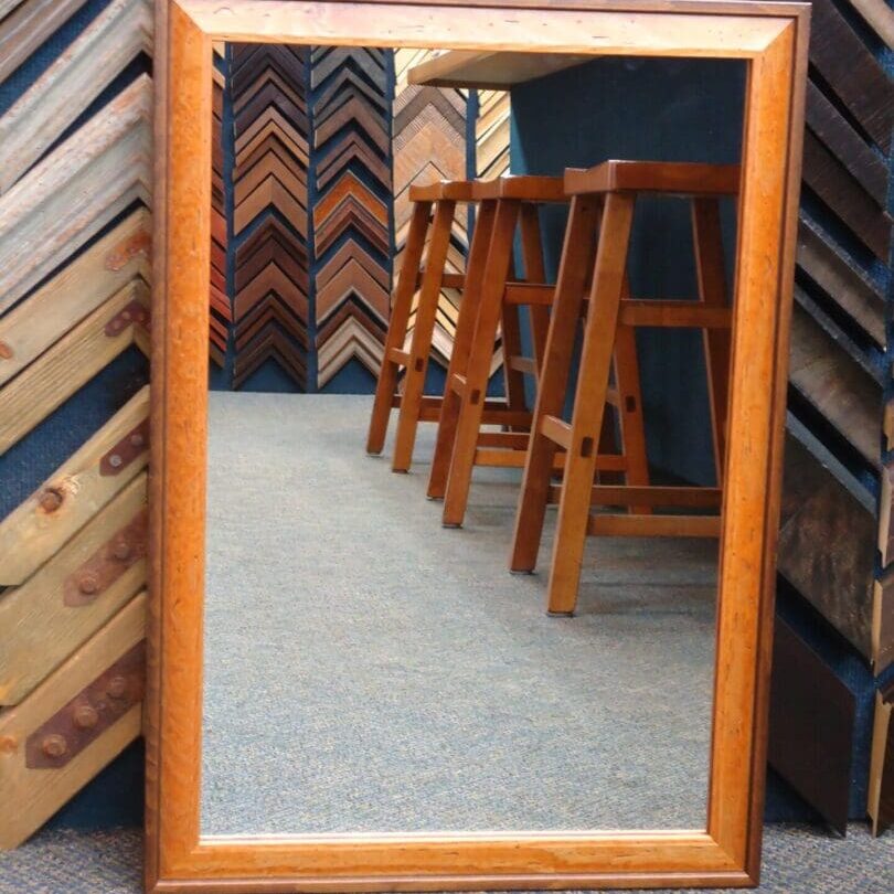 DSC04273 Wooden mirror reflecting stools and framing samples.